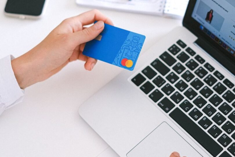 person holding bank card